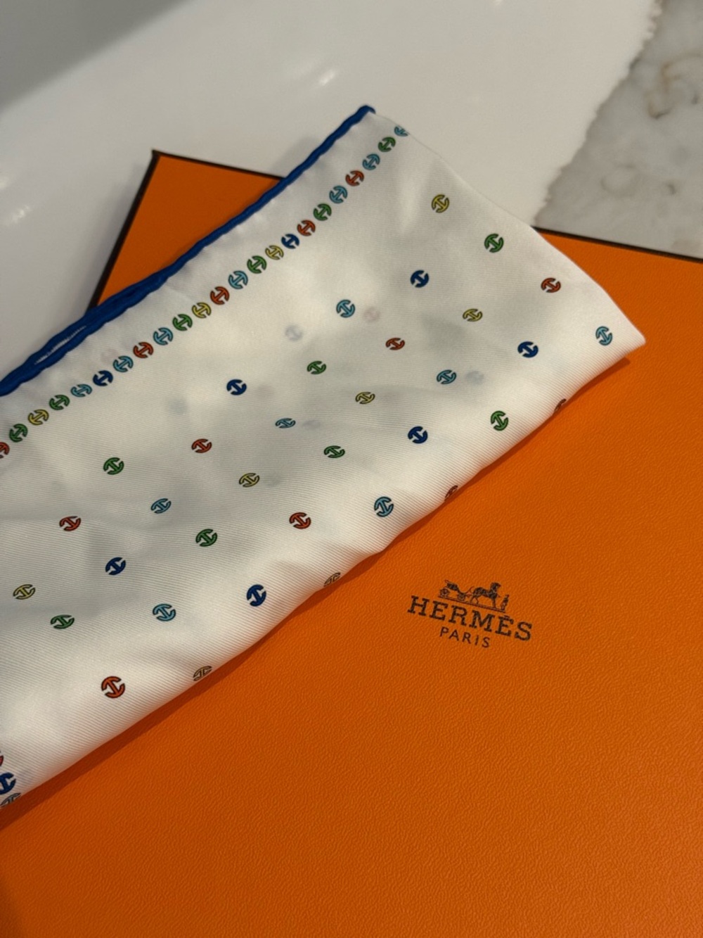 Hermès White Silk Scarf with Multicolor Motif and Blue Edge